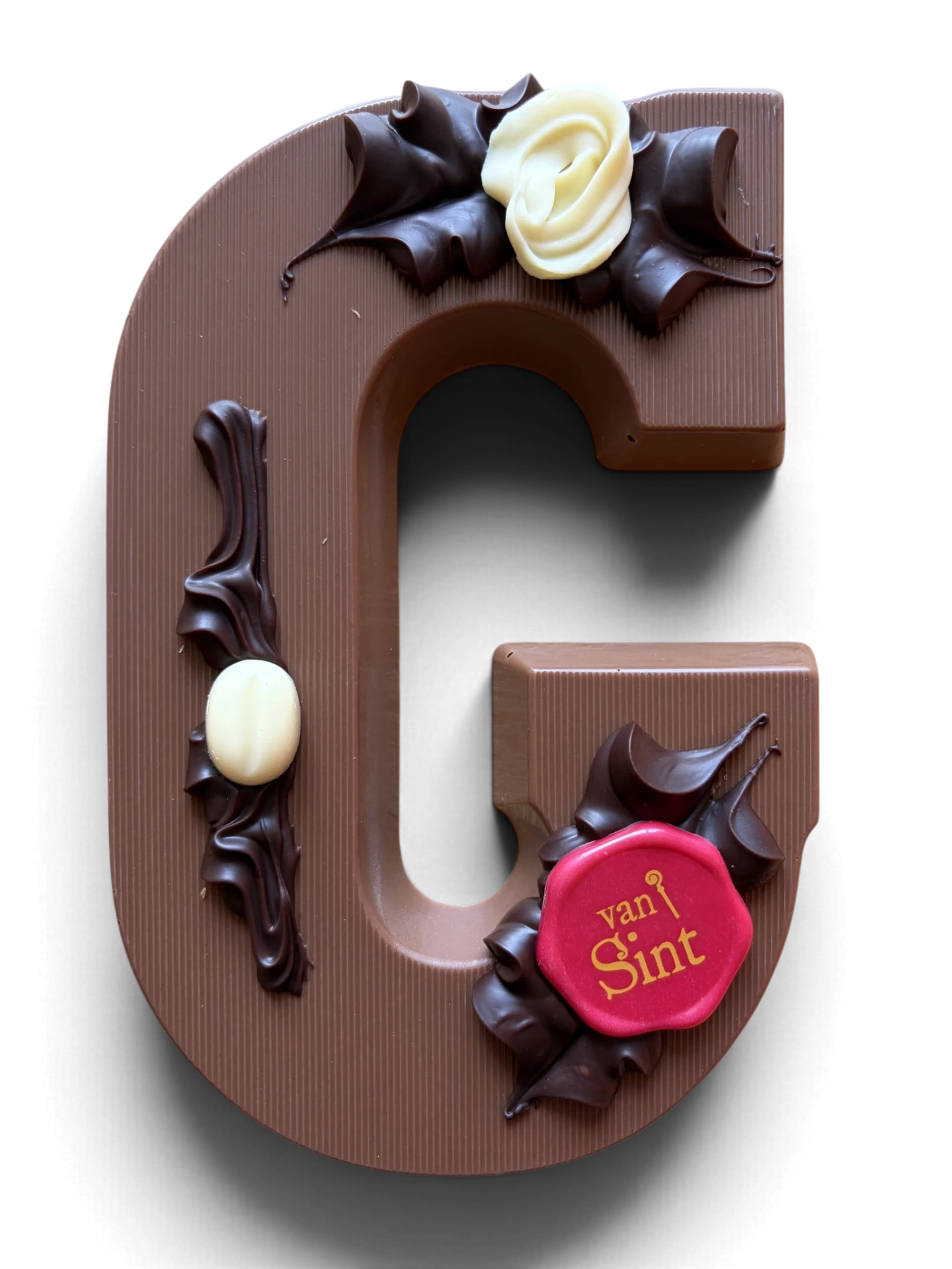 Chocoladeletter G, melk, Van Sint-zegel