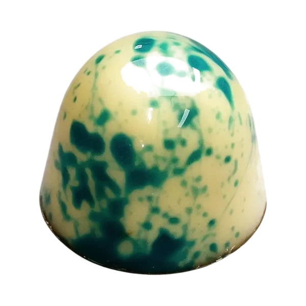 Cocos: lichte ronde bonbon met blauwgroene spikkels