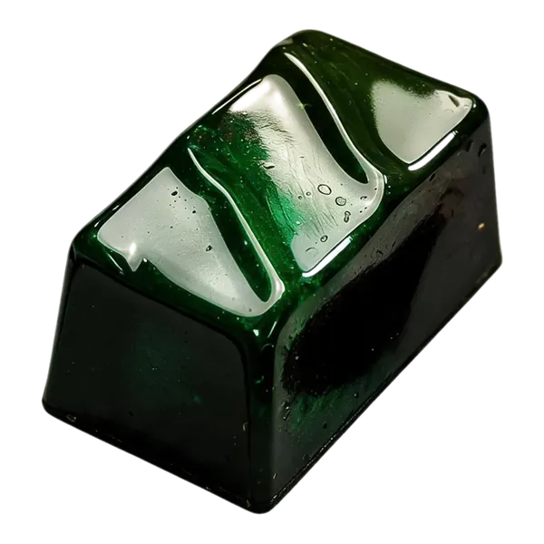 Pinda caramel: donkergroene rechthoekige bonbon met witte en groene strepen